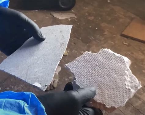 Identifying handling low density asbestos fibre board.